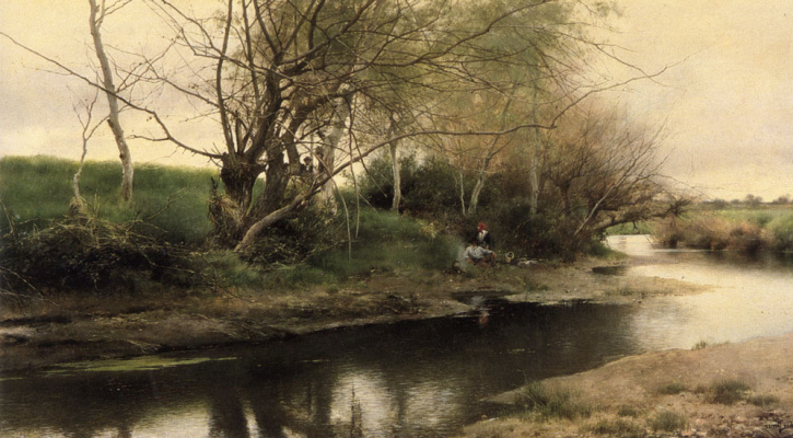 on the banks of the river