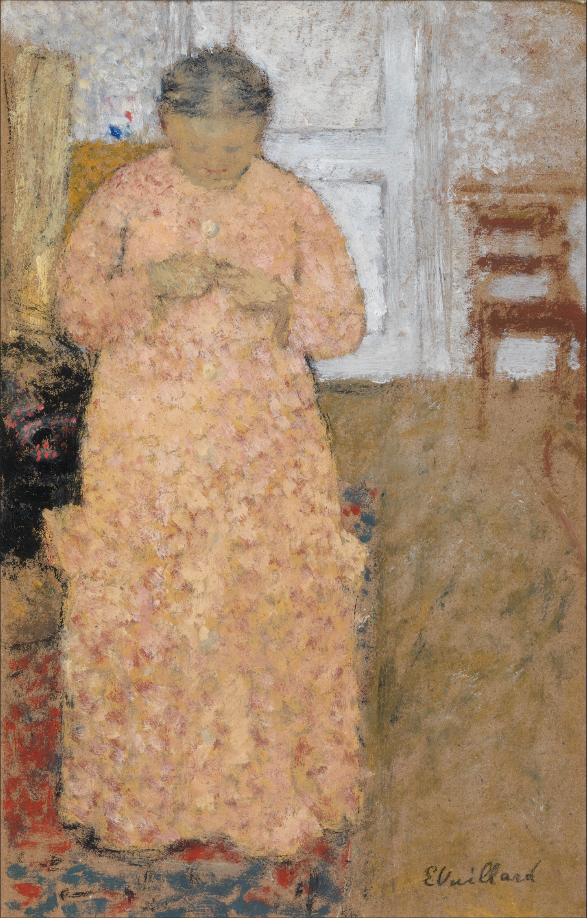 Женщина в розовом за вязанием