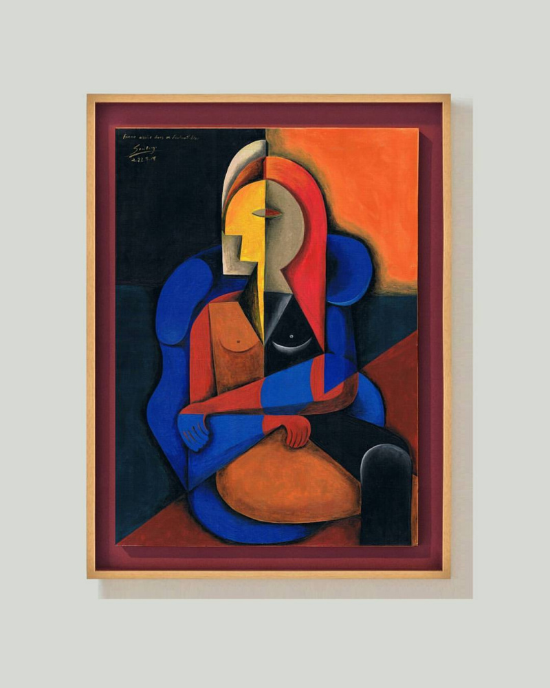 Arturo Carmona. Femme assise dans fauteuil bleu