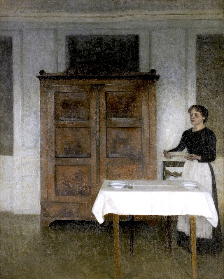 Вильгельм Хаммерсхёй. Интерьер с девушкой, накрывающей стол