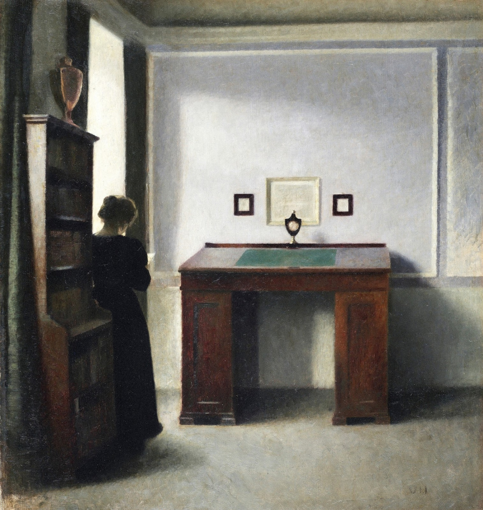 Вильгельм Хаммерсхёй. Молодая женщина и письменный стол в интерьере